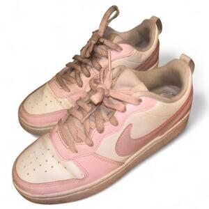 Pink and white nike shoes